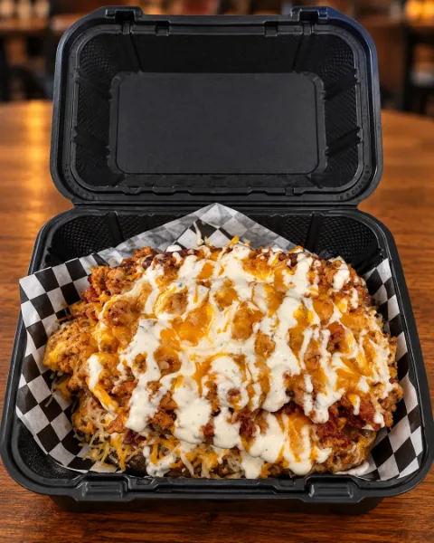 C.B.R. Flo baked potato with chicken, bacon and ranch drizzle in a takeout box