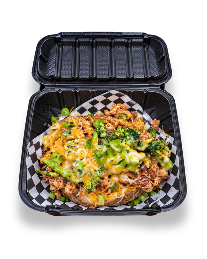 OverFlo Potato loaded baked potato with chicken, broccoli and melted cheese in a takeout box